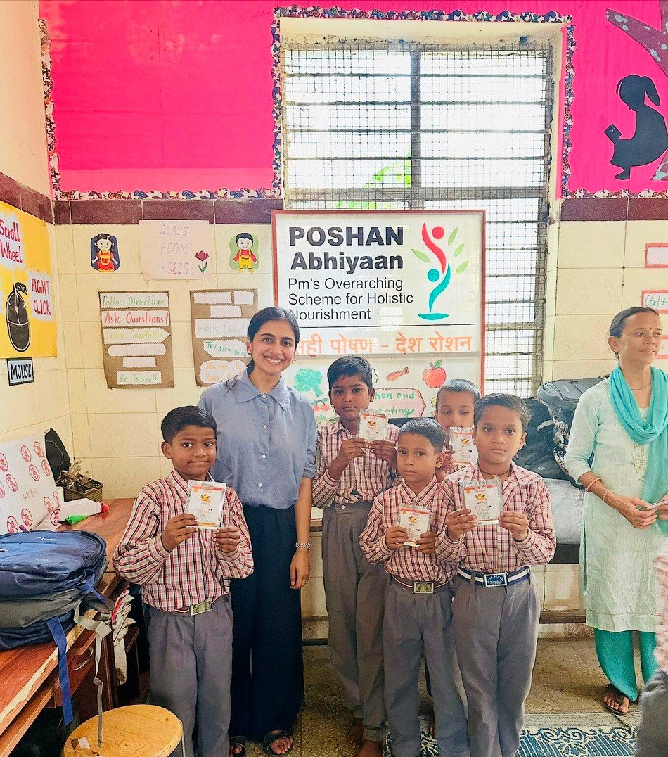 Mosachi program staff distributing Mosachi's Iron Fruit Bar under the Poshan Abhiyaan scheme